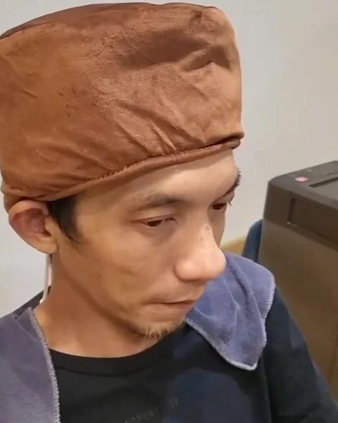 Steam cap over a client’s scalp